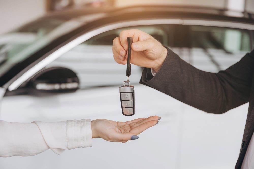 Man,Handing,Car,Smart,Key.,Car,Rental.,Car,Sharing.